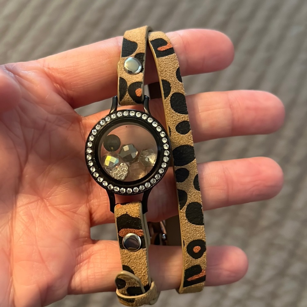 Origami owl wrap bracelet with charms.